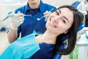 Patient smiling during periodontal treatment in Lake Charles, LA