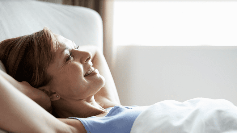 Woman resting in her bed