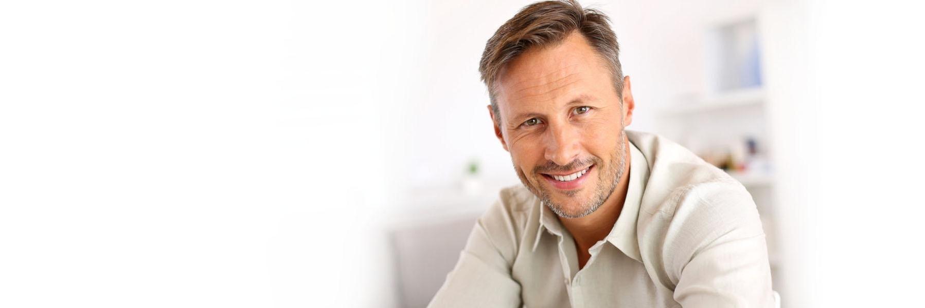 Adult man wearing dental implants in 70605