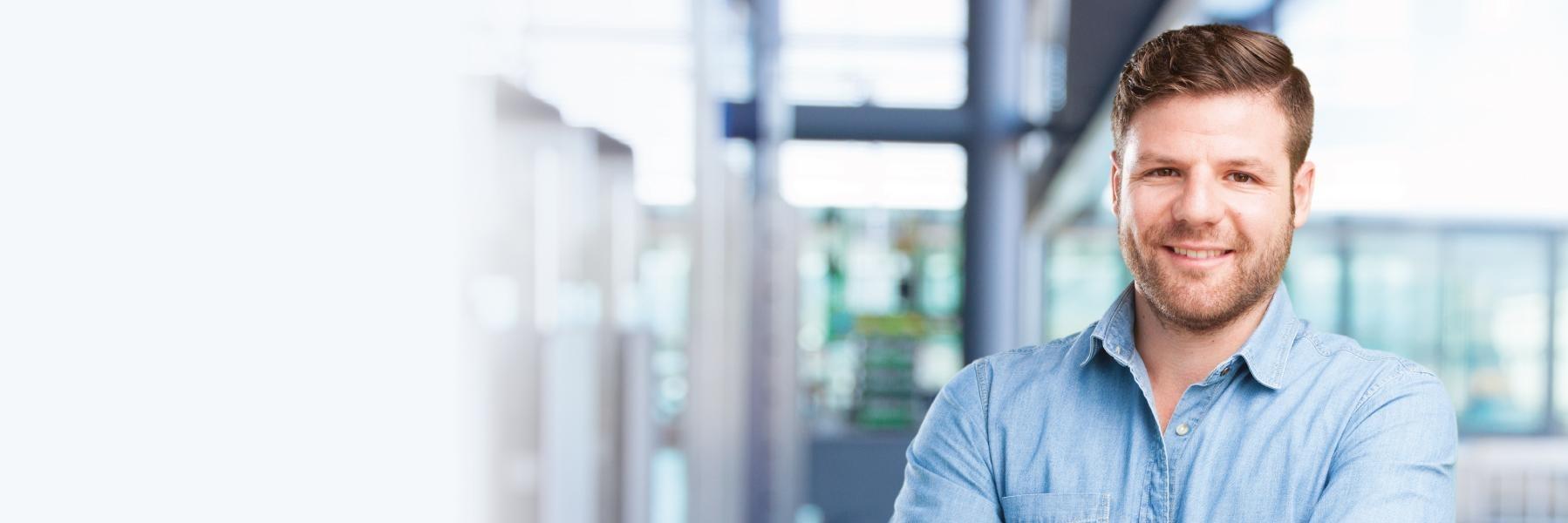 Man smiling inside dentist office in Lake Charles LA