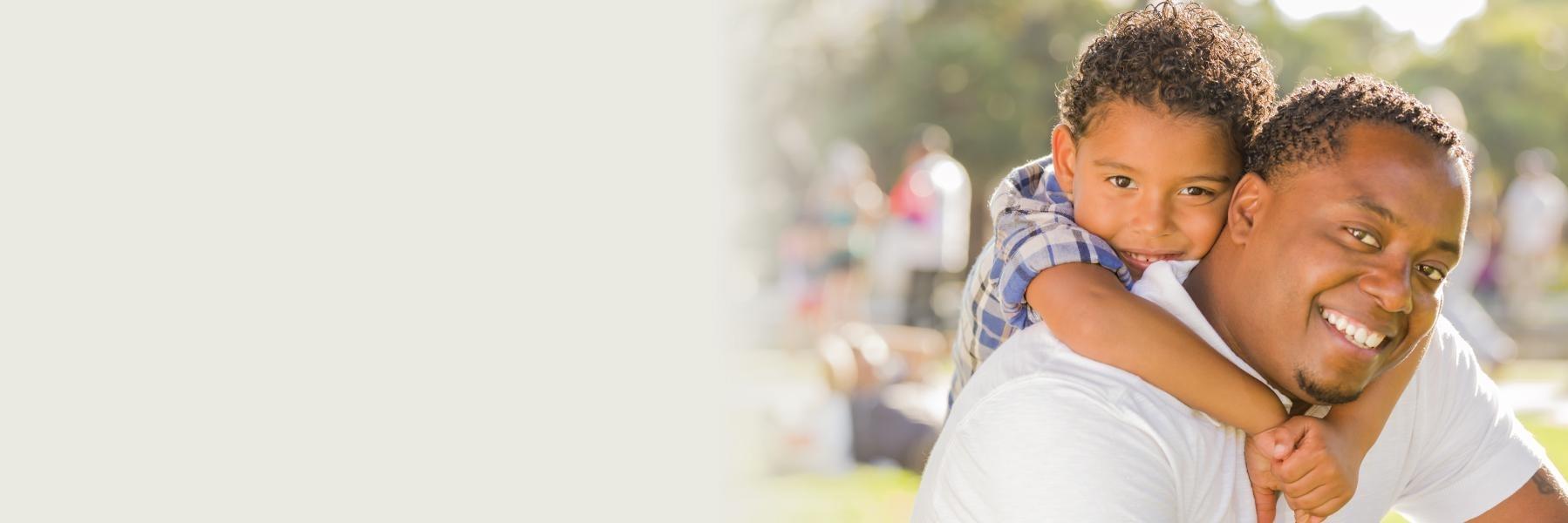 Father and son smiling near childrens dentist in Lake Charles LA