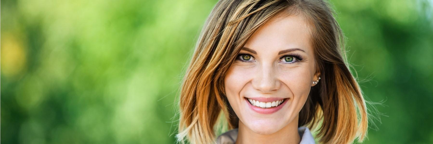 Woman with CEREC dental crowns smiling near Lake Charles, LA